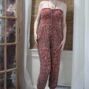 Red patterned jumpsuit with cinch